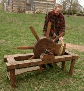 Bro. Christian using scutching wheel ca. 1994.
