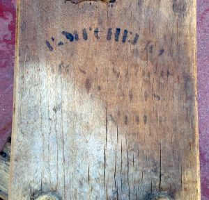 Water-damaged stencil markings on the table