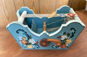 Painted reproduction of "cradle loom" by Merlin Lee