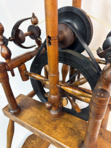 Detail of front of spinning wheel marked B. SANFORD
